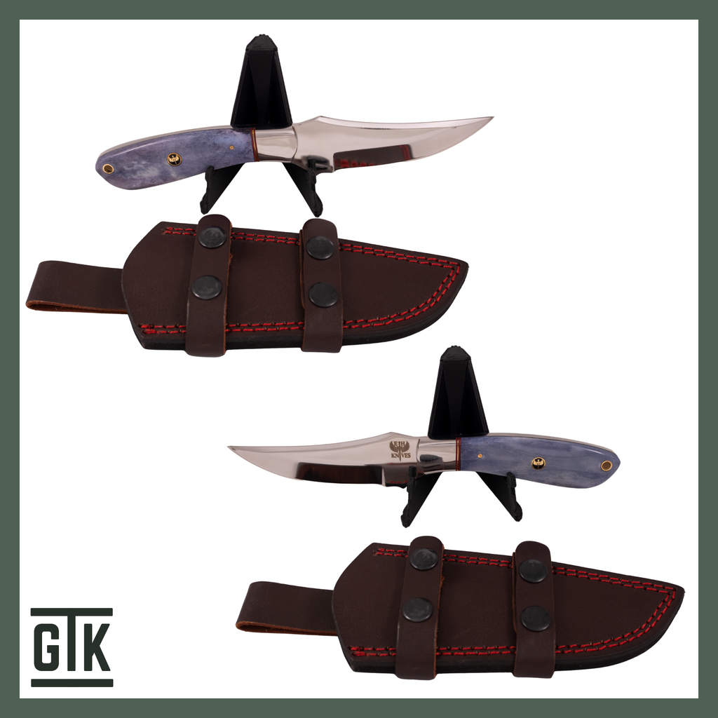 Jasper Sunset full-tang trailing-point knife with a polished upswept blade, dyed lavender camel bone handle, and brown sheath with red stitching.